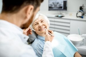 Senior woman getting dental implants