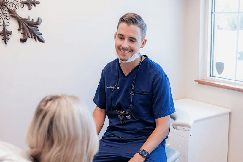 Dr. Connor Huelsman with patient smiling during dental visit in Columbus Ohio